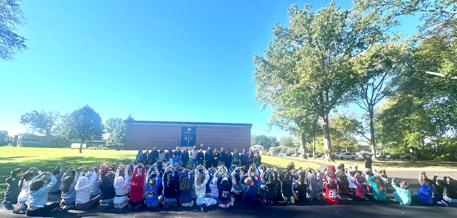 Livingston Avenue School students showing their best hearts as school staff and members of The Aliver Foundation, CFD, and CPD look on.