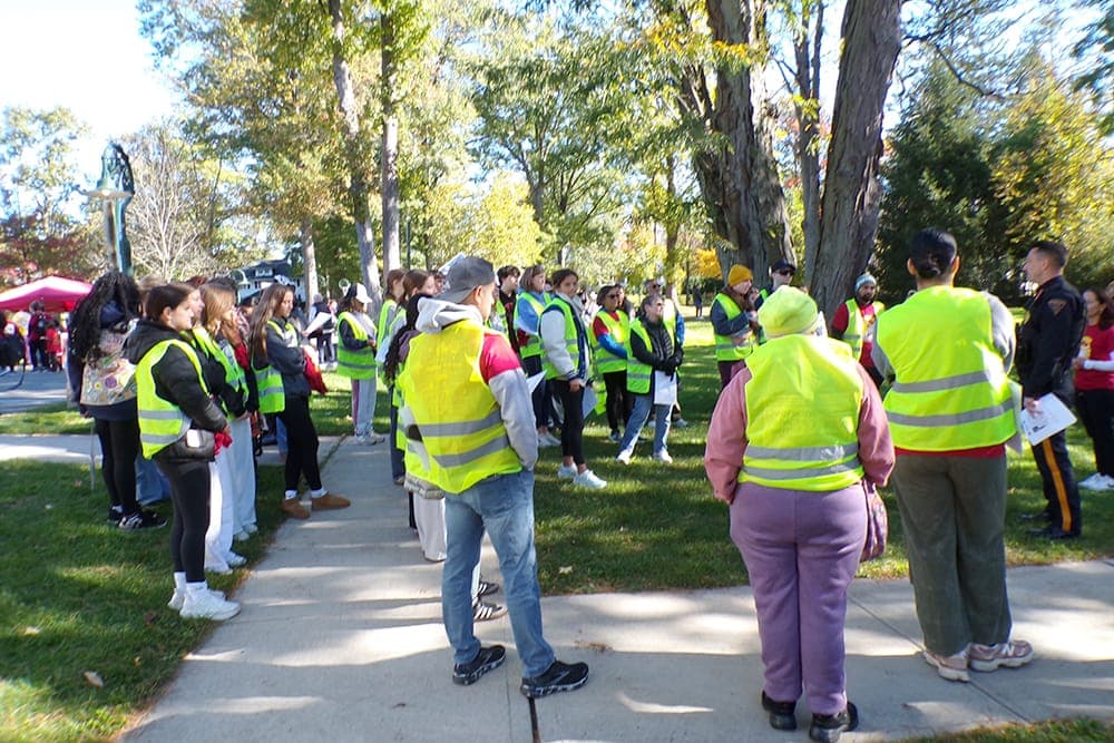 Police Capt. Dan Kranz gives instructions to 5K and Family Fun Run field marshals.